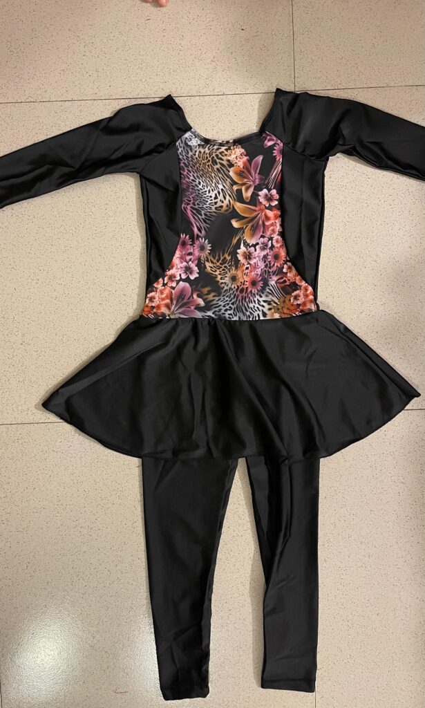Girls black swimming costume with brown and pink floral design and skirt - Little Fit
